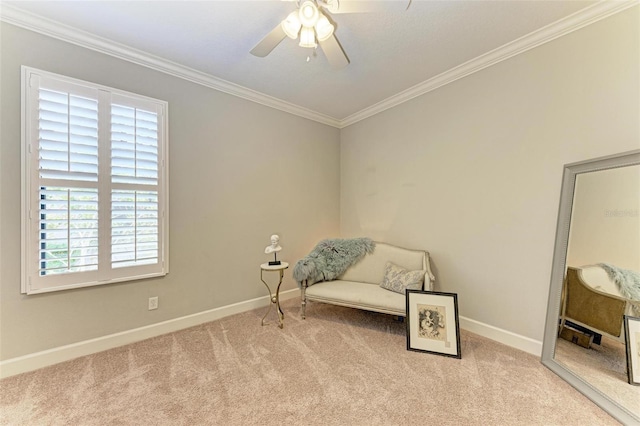 living area featuring crown molding, ceiling fan, and light colored carpet