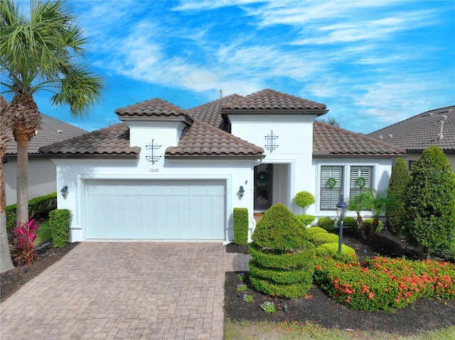 mediterranean / spanish-style home featuring a garage