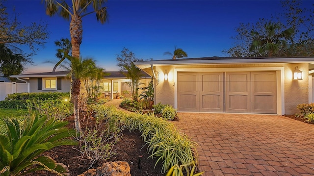 ranch-style house featuring a garage