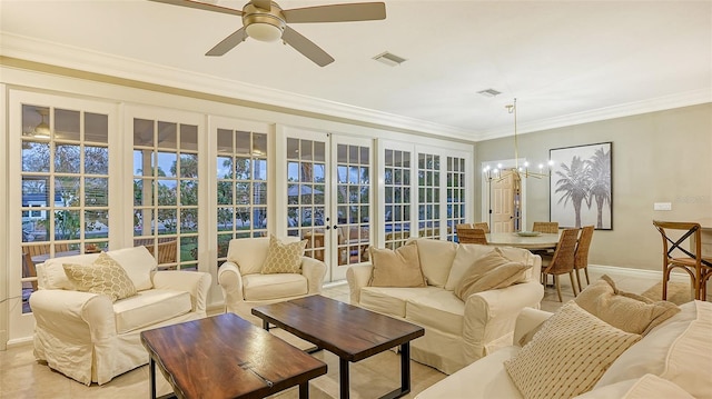 sunroom / solarium featuring ceiling fan with notable chandelier