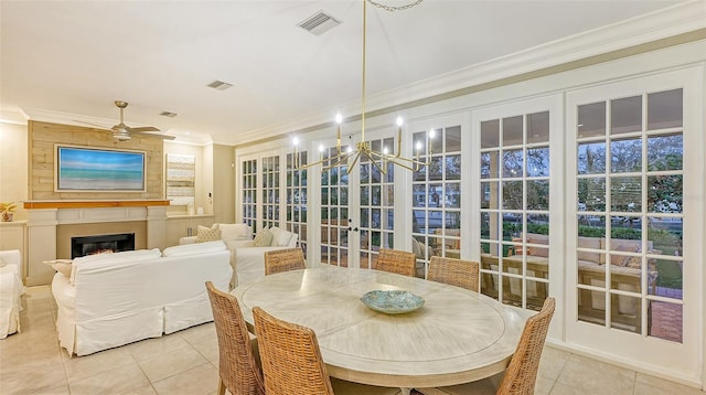 sunroom / solarium with ceiling fan and french doors