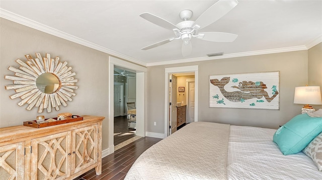 bedroom featuring ceiling fan, dark hardwood / wood-style floors, ensuite bathroom, and crown molding