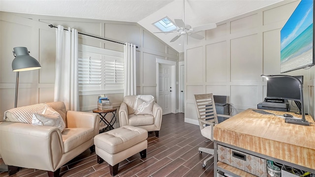 office with vaulted ceiling with skylight, ceiling fan, and dark hardwood / wood-style flooring