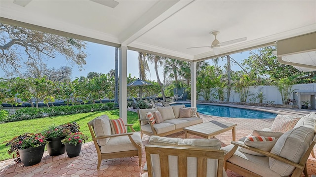 exterior space featuring ceiling fan and beamed ceiling