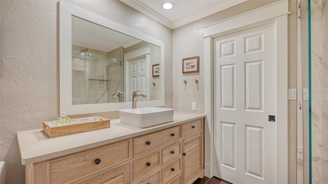 bathroom with vanity and ornamental molding