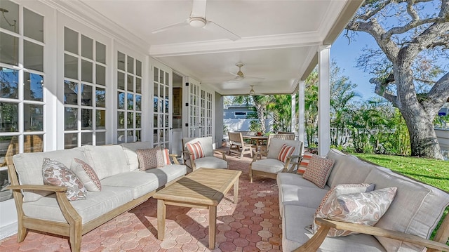 view of patio featuring outdoor lounge area, french doors, and ceiling fan