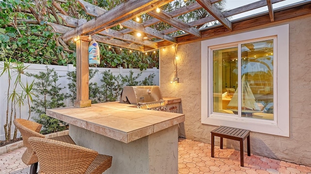 view of patio / terrace featuring a pergola and grilling area