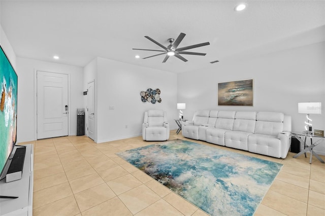 living room featuring ceiling fan and light tile patterned flooring