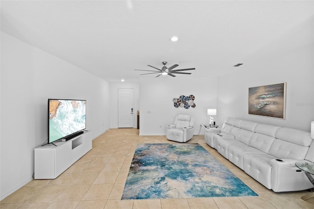 living room featuring ceiling fan and light tile patterned flooring