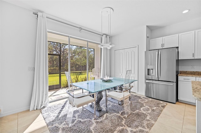 dining space with light tile patterned floors