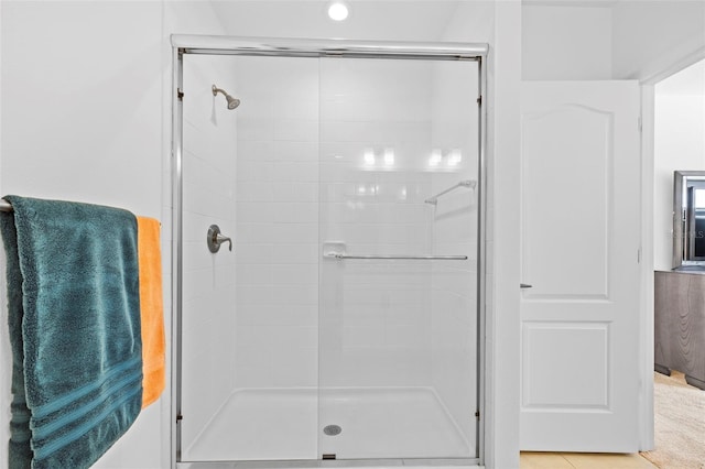 bathroom featuring an enclosed shower