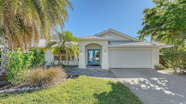 view of front of home featuring a garage and french doors