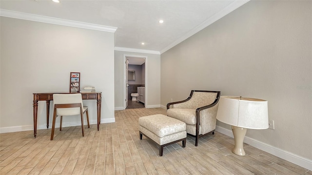 living area featuring crown molding and light hardwood / wood-style flooring