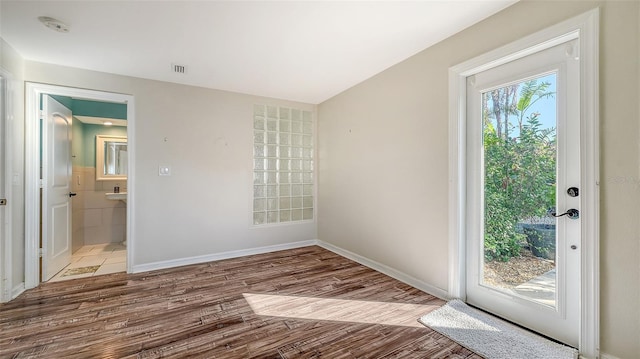 entryway with light hardwood / wood-style floors