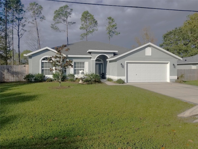 single story home featuring a front lawn and a garage