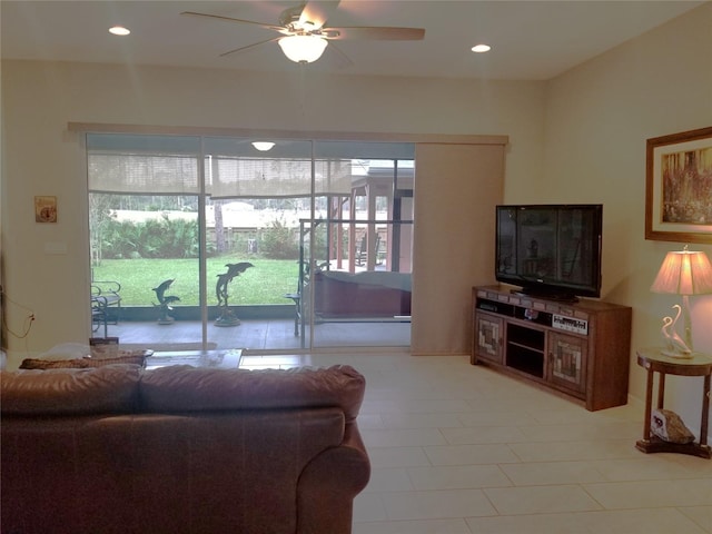 living room with ceiling fan and light tile patterned floors