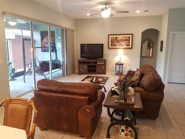 tiled living room featuring ceiling fan