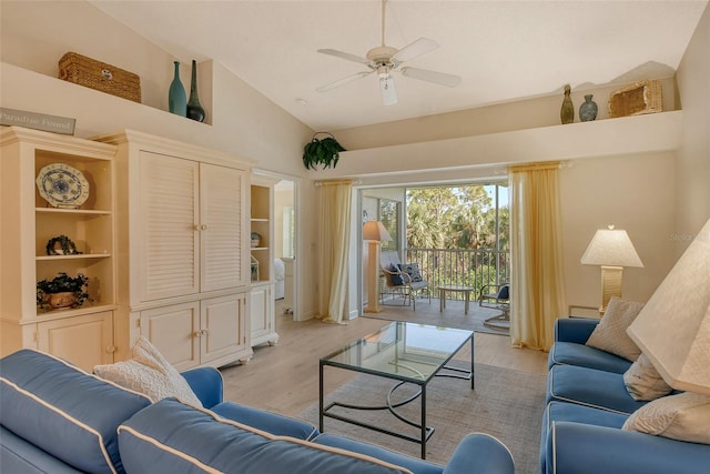 living room with ceiling fan, light hardwood / wood-style flooring, and high vaulted ceiling