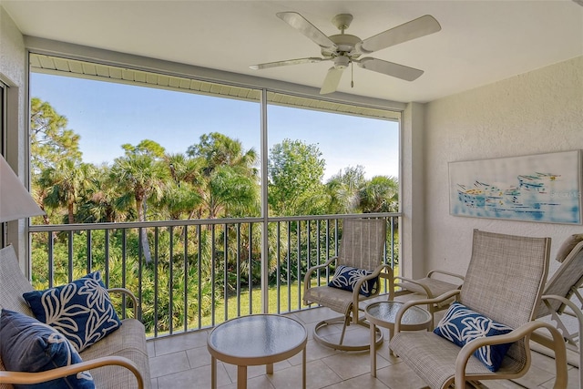 sunroom featuring ceiling fan