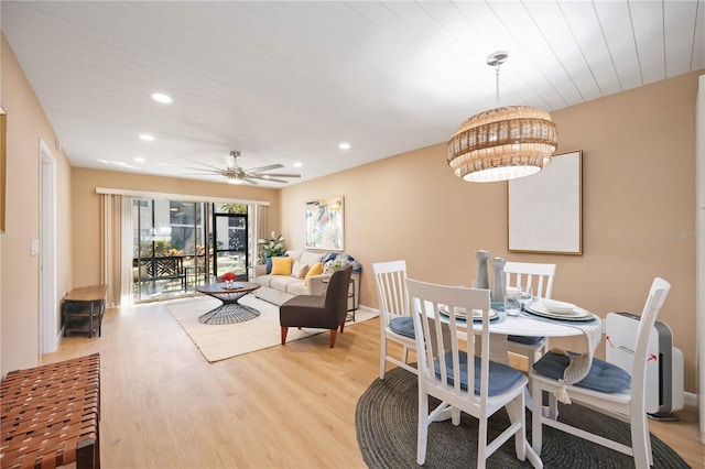 dining area with wood ceiling, ceiling fan, and light hardwood / wood-style flooring