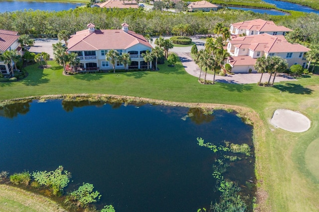 birds eye view of property with a water view