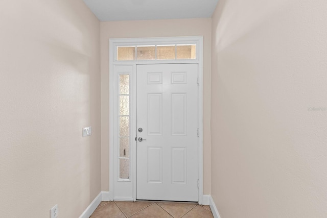 doorway to outside featuring light tile patterned floors