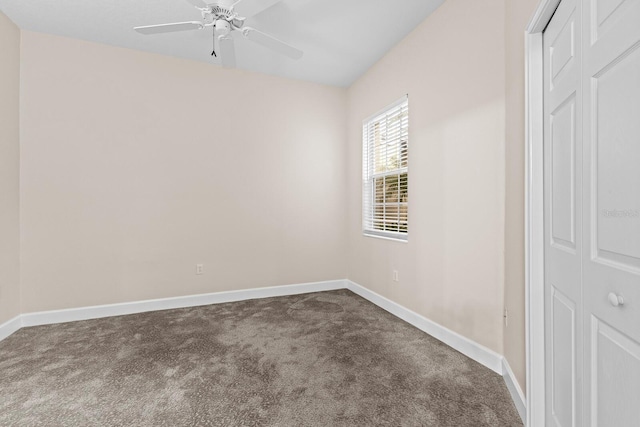 unfurnished room featuring ceiling fan and carpet floors