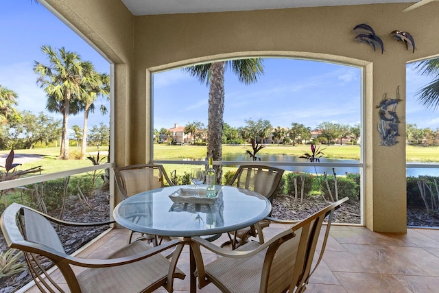 sunroom with a water view