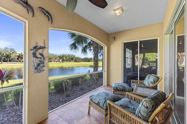 sunroom with a water view and vaulted ceiling