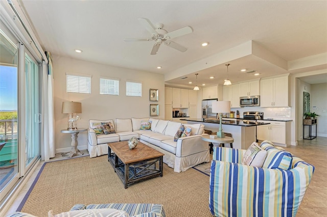 living room featuring ceiling fan