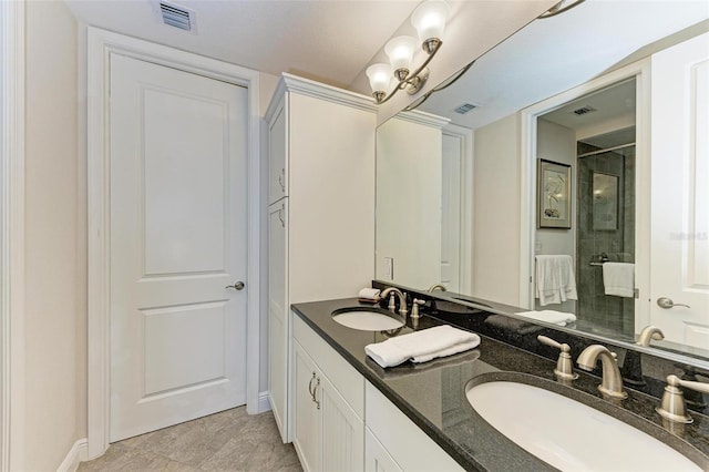 bathroom with vanity and a shower with shower door