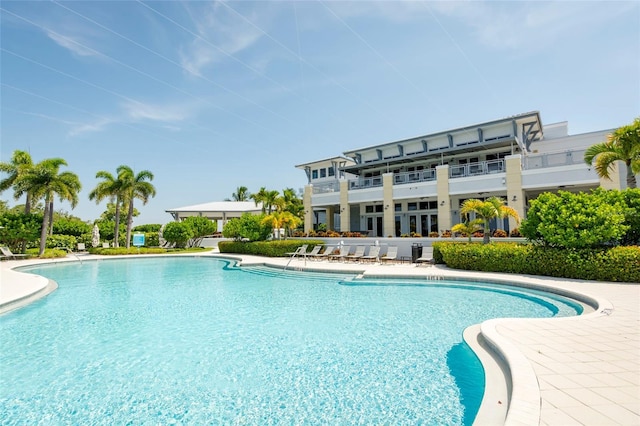 view of swimming pool featuring a patio area