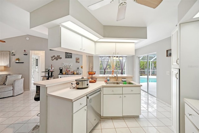 kitchen with dishwasher, sink, ceiling fan, white cabinetry, and kitchen peninsula