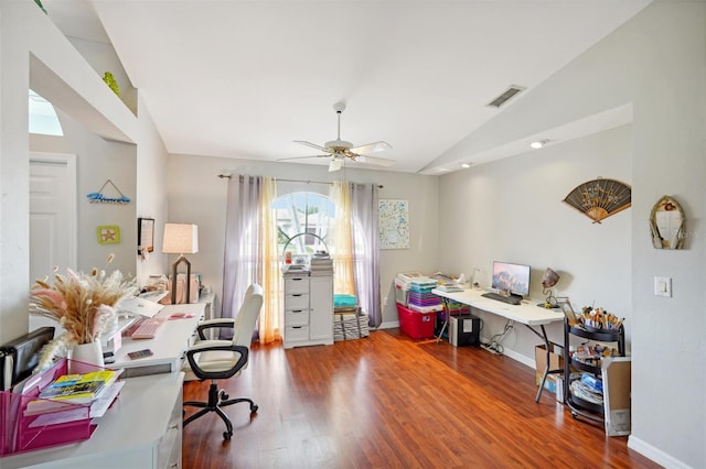 office space featuring hardwood / wood-style flooring, ceiling fan, and vaulted ceiling