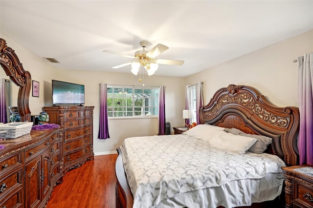 bedroom featuring ceiling fan and dark hardwood / wood-style floors