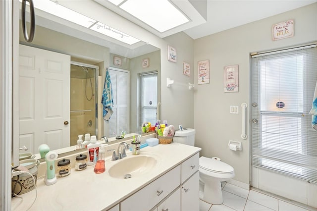 bathroom with toilet, vanity, tile patterned floors, and a shower with door