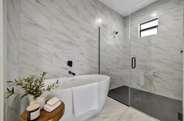 bathroom featuring separate shower and tub and tile walls