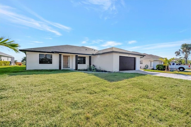 view of front of property with a garage and a front lawn