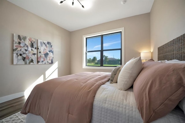 bedroom featuring wood-type flooring