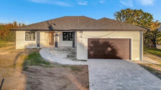 ranch-style home featuring a garage