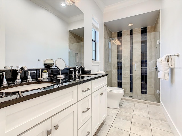 bathroom with tile patterned flooring, vanity, crown molding, and a shower with shower door