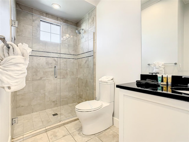 bathroom with tile patterned floors, vanity, toilet, and walk in shower