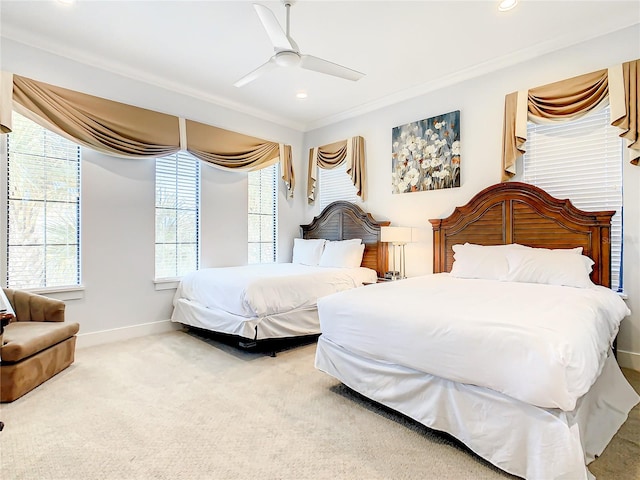 bedroom with carpet floors, ceiling fan, and crown molding