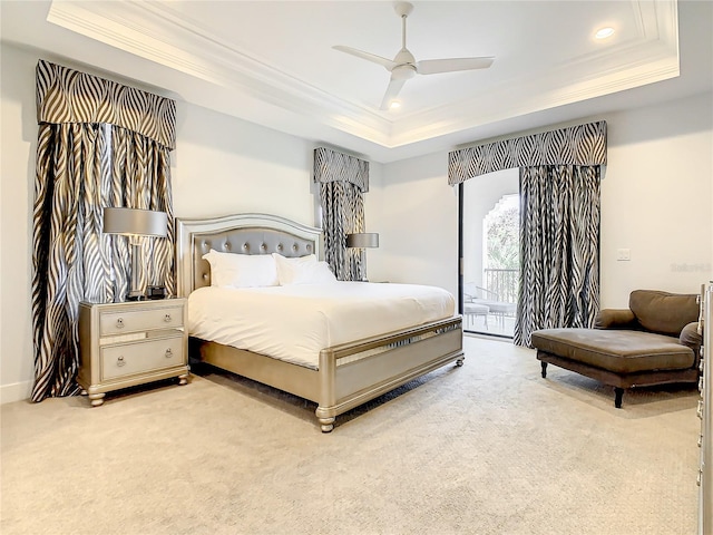 bedroom with a raised ceiling, crown molding, ceiling fan, access to exterior, and light colored carpet