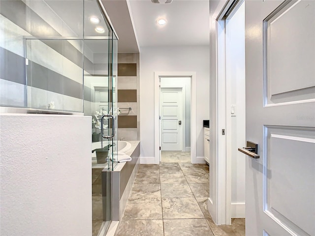 bathroom with separate shower and tub