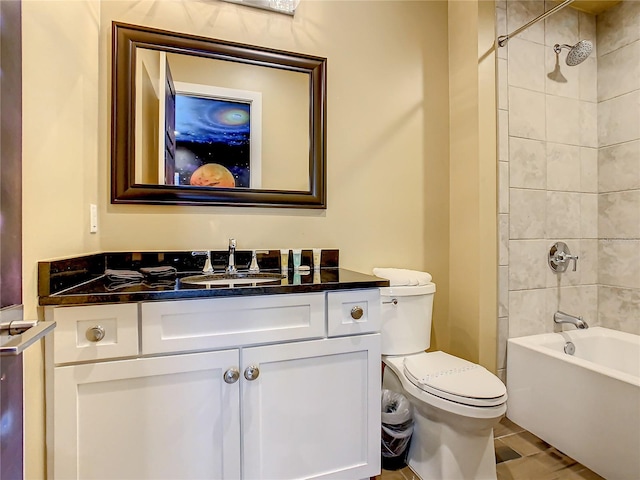 full bathroom featuring vanity, toilet, and tiled shower / bath combo