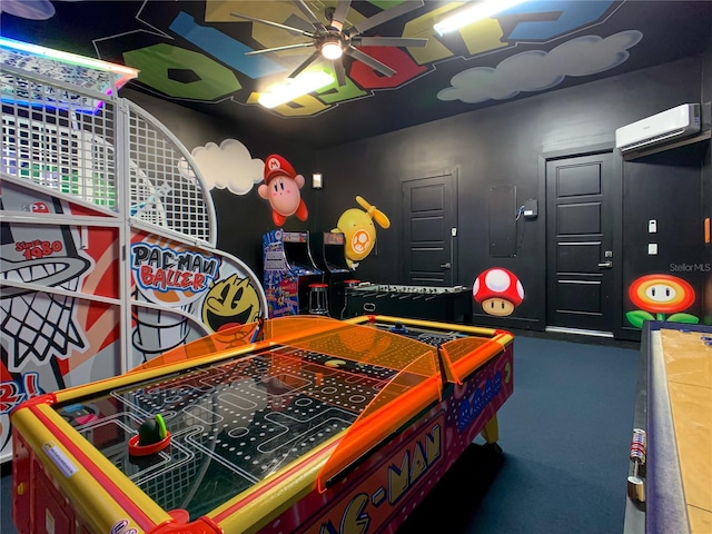 game room with carpet flooring, ceiling fan, and a wall unit AC