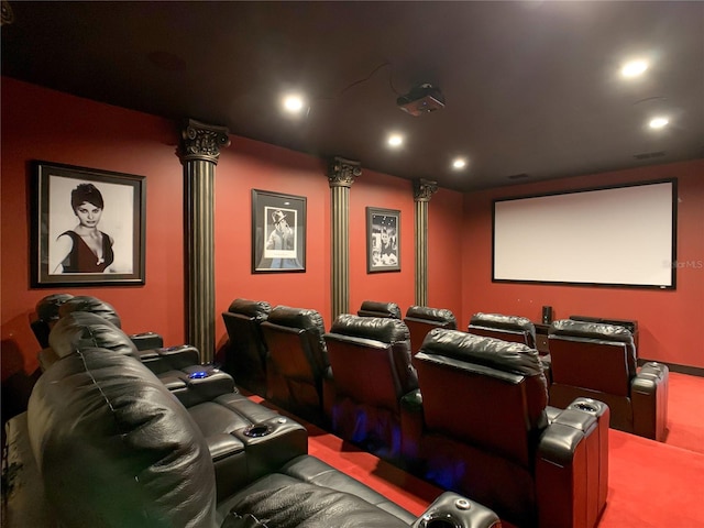 home theater room featuring carpet flooring and ornate columns