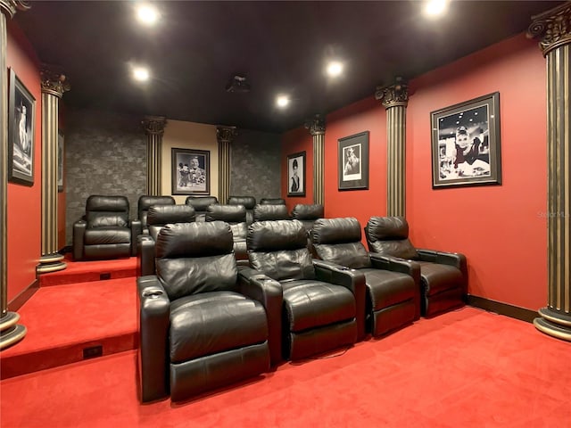 cinema room featuring carpet flooring and ornate columns