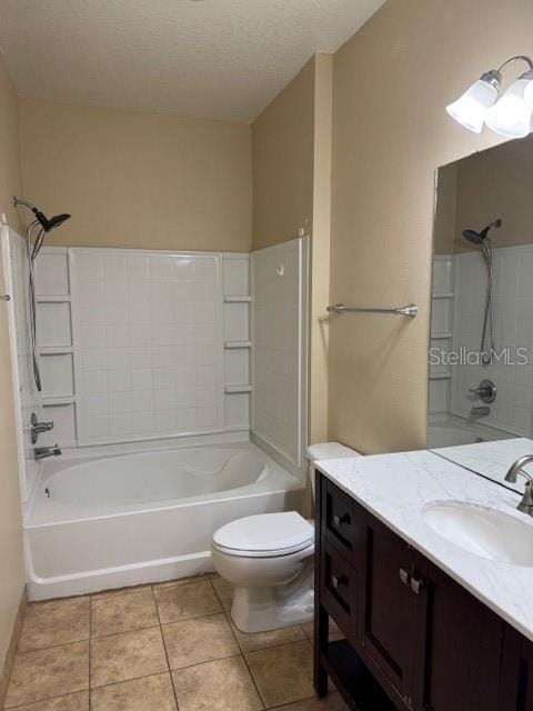 full bathroom featuring tub / shower combination, tile patterned floors, a textured ceiling, toilet, and vanity